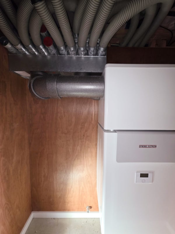 A heat recovery ventilation unit installed in an Otago home, with the duct manifold connected