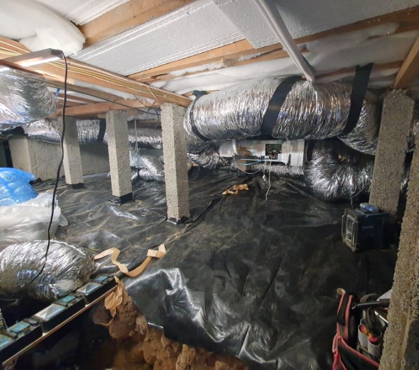 Insulated ducting run through the subfloor of a Dunedin home for a ducted heating system