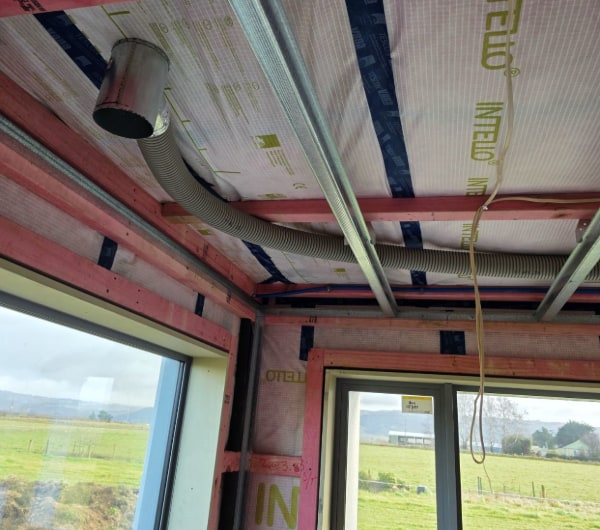 Ventilation duct runs through the ceiling framing of an Otago new build before lining